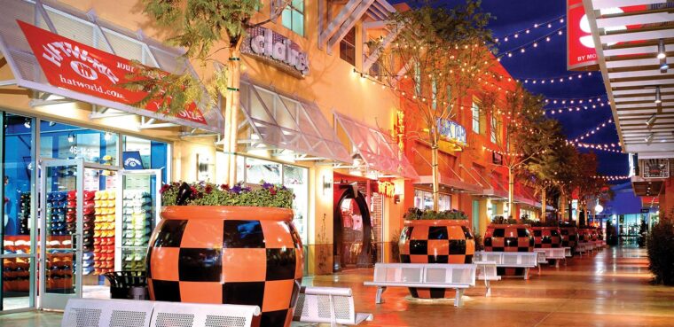 benches and trees outside of shops at the desert ridge district marketplace