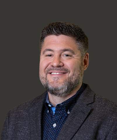 A headshot of Brian Bowles