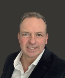 A headshot of Derek Price
