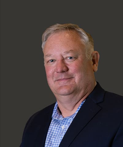 A headshot of Kevin Mousty