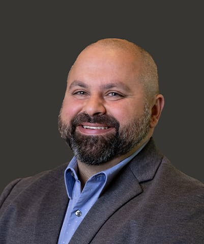 A headshot of Tom George