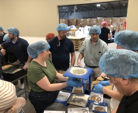 mcg employees volunteering at the food bank