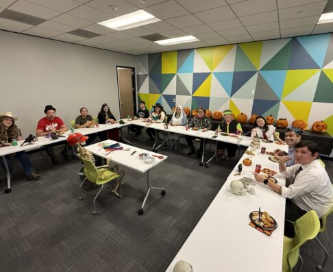 mvg employees sitting around a table