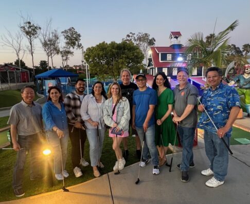 mcg employees playing mini golf