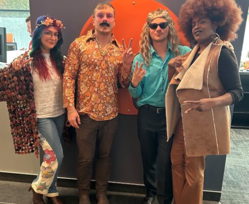 four people dressed in halloween costumes